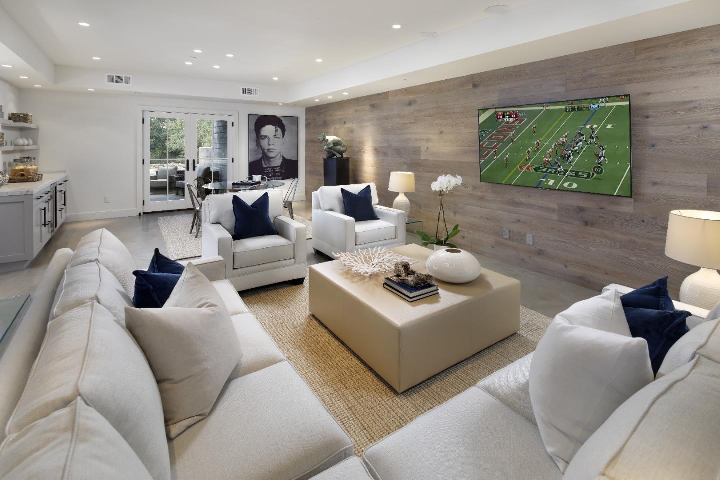 135 Dean Road Woodside, CA 94062 - Photo 20 of 31 a living room with furniture and a flat screen tv