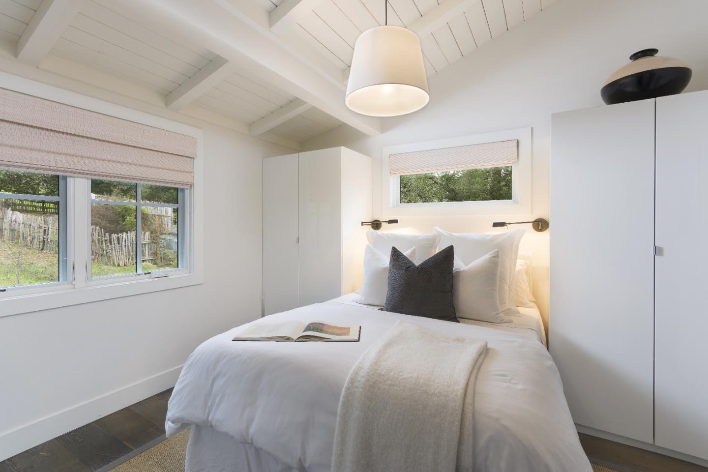 135 Dean Road Woodside, CA 94062 - Photo 27 of 31 a bedroom with a bed and a window