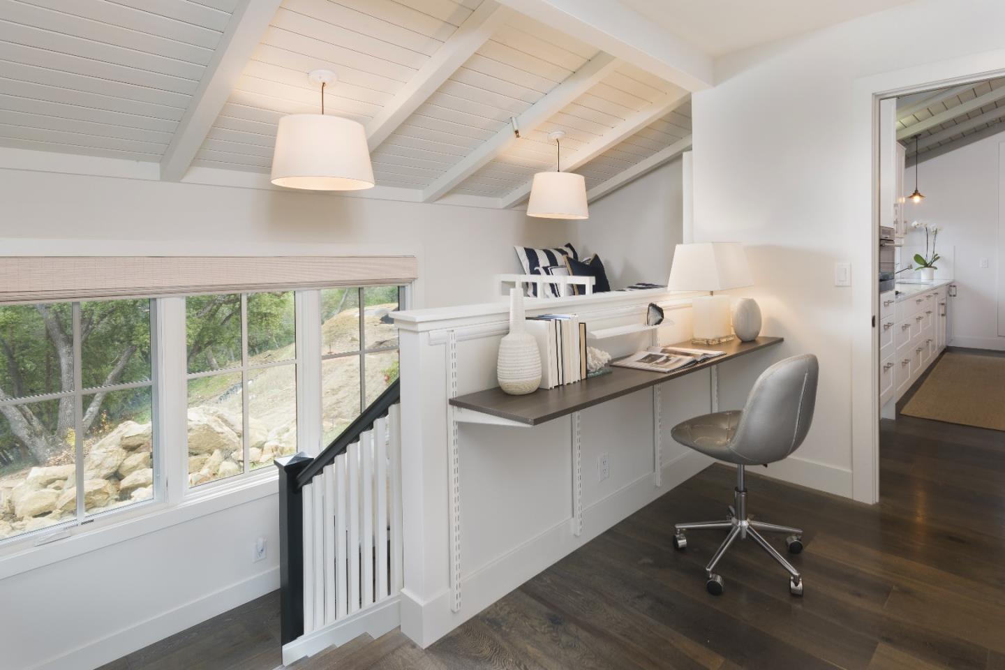 135 Dean Road Woodside, CA 94062 - Photo 28 of 31 a view of a workspace with furniture and a window