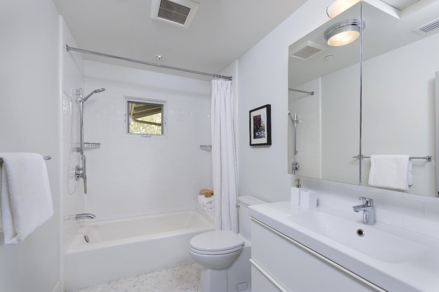 135 Dean Road Woodside, CA 94062 - Photo 29 of 31 a bathroom with a sink a toilet and a bathtub