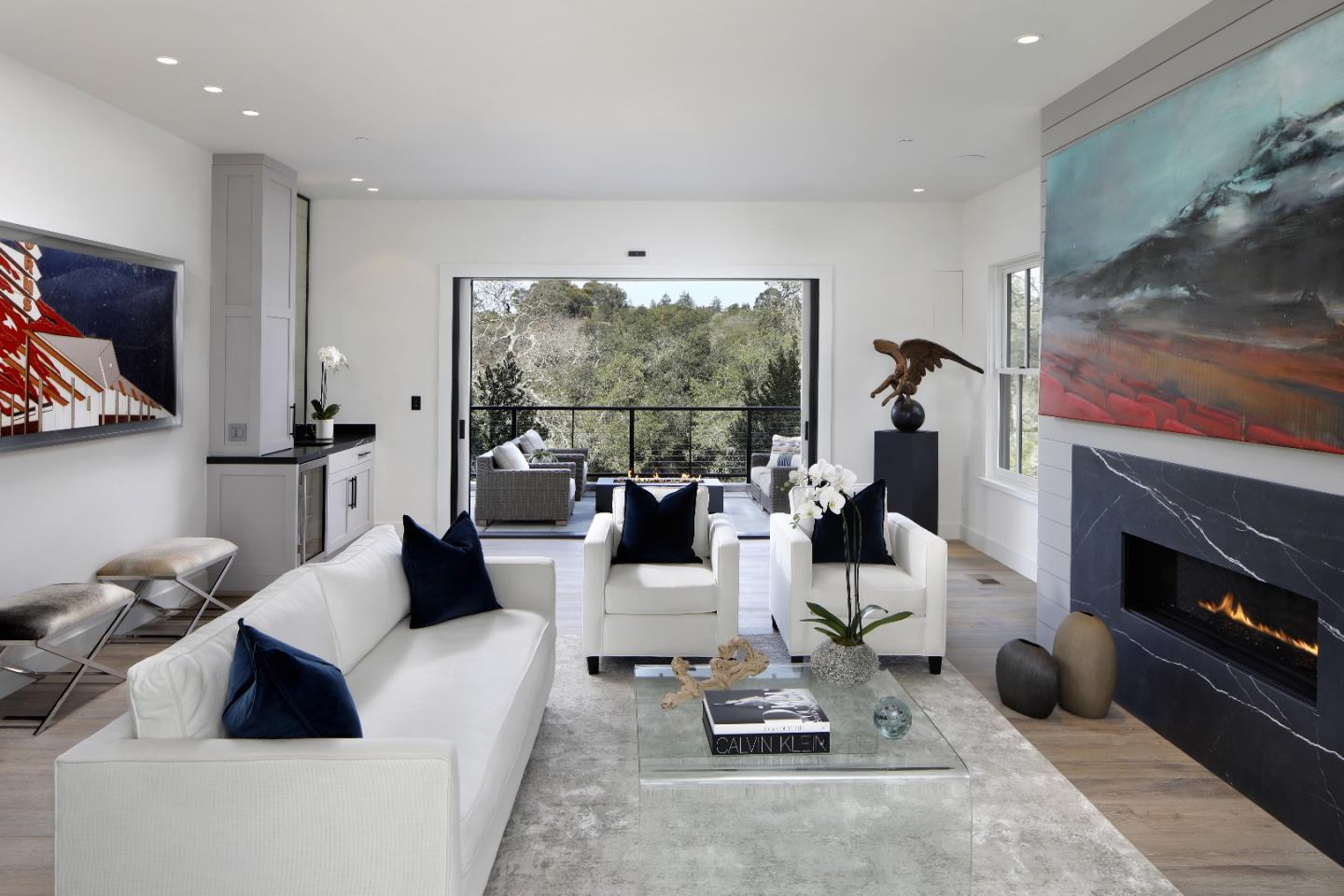 135 Dean Road Woodside, CA 94062 - Photo 6 of 31 a living room with furniture a flat screen tv and a fireplace