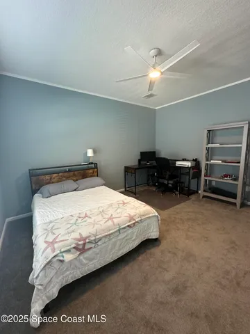 a bedroom with a bed and dresser