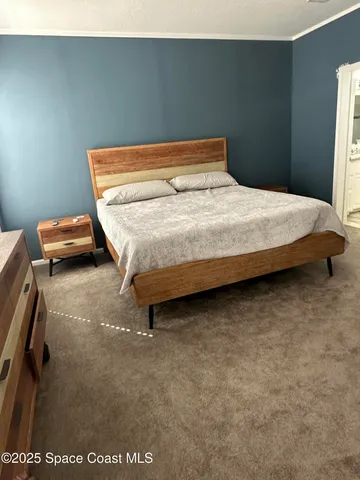 a bedroom with a bed and a table in it