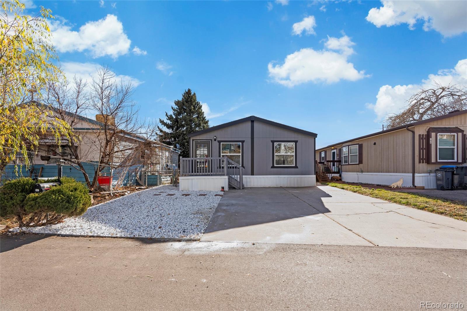 197 Pinto Street Golden, CO 80401 - Photo 1 of 19 a front view of a house with a yard and garage