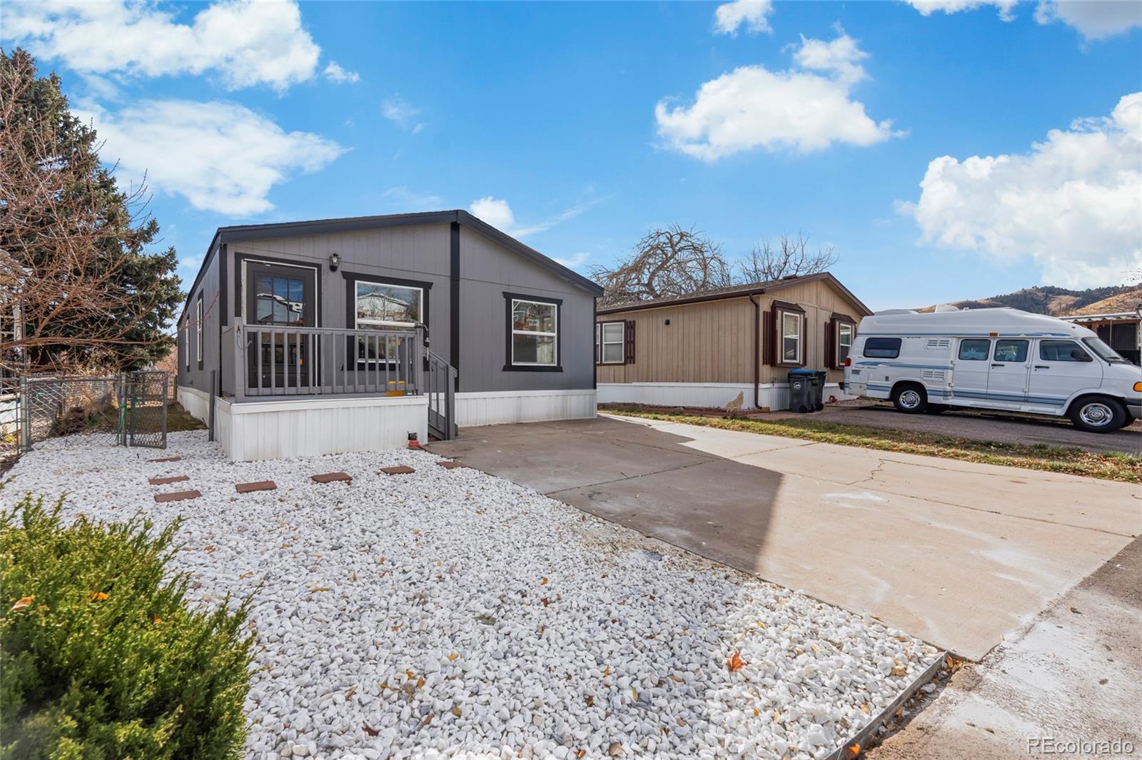197 Pinto Street Golden, CO 80401 - Photo 17 of 19 a front view of a house with a yard and garage