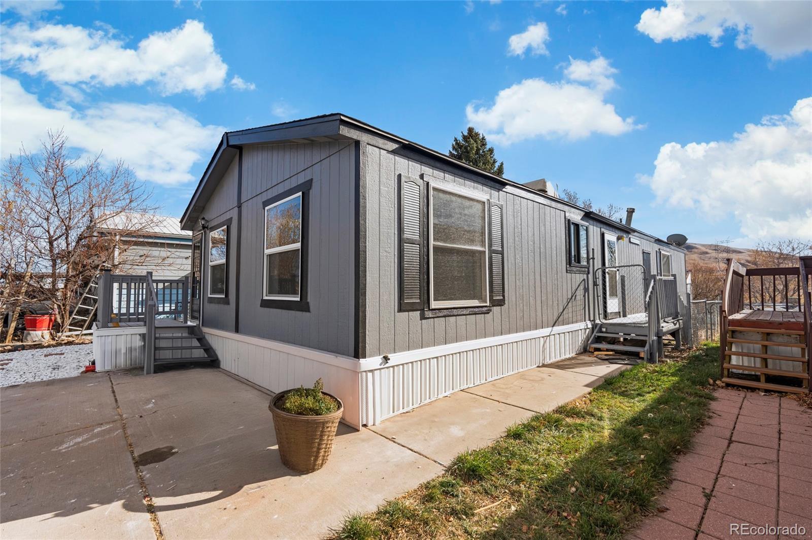 197 Pinto Street Golden, CO 80401 - Photo 18 of 19 a front view of a house with a garden