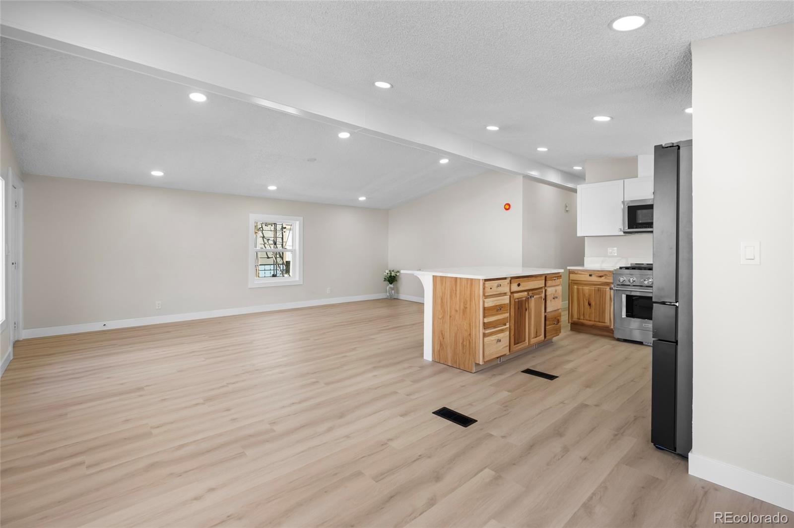 197 Pinto Street Golden, CO 80401 - Photo 4 of 19 a view of kitchen with cabinets and wooden floor