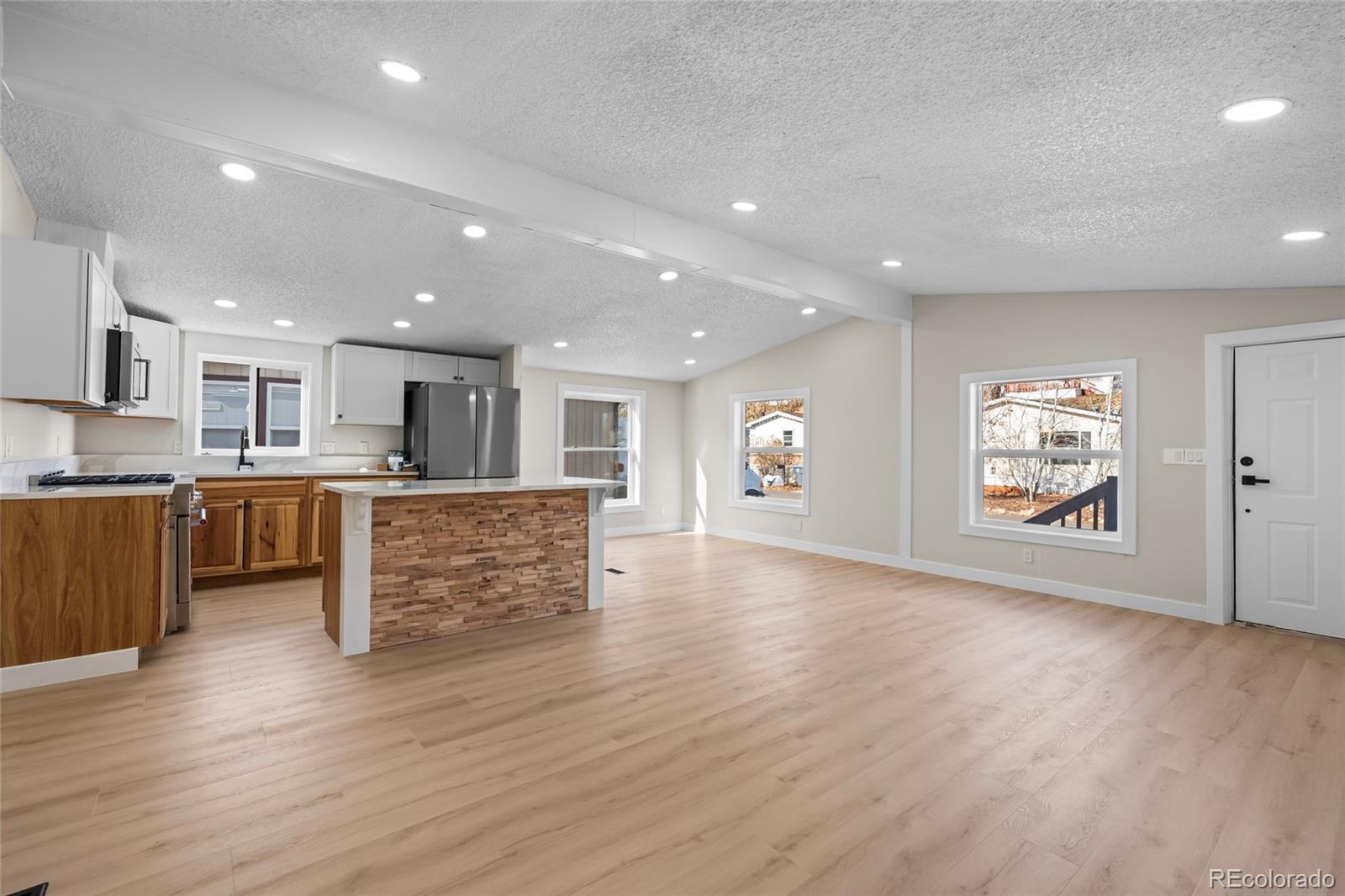 197 Pinto Street Golden, CO 80401 - Photo 8 of 19 a view of kitchen with cabinets and wooden floor