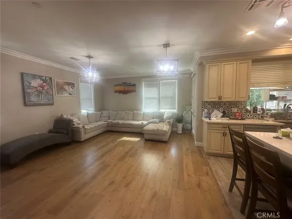 a kitchen with sink refrigerator and stove