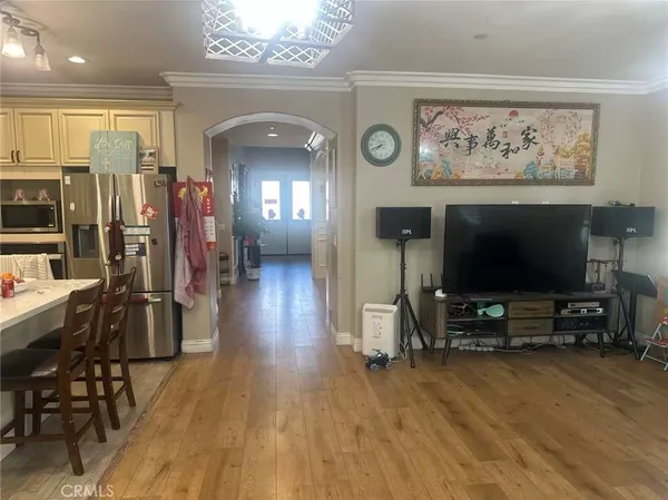 an living room with furniture and a flat screen tv