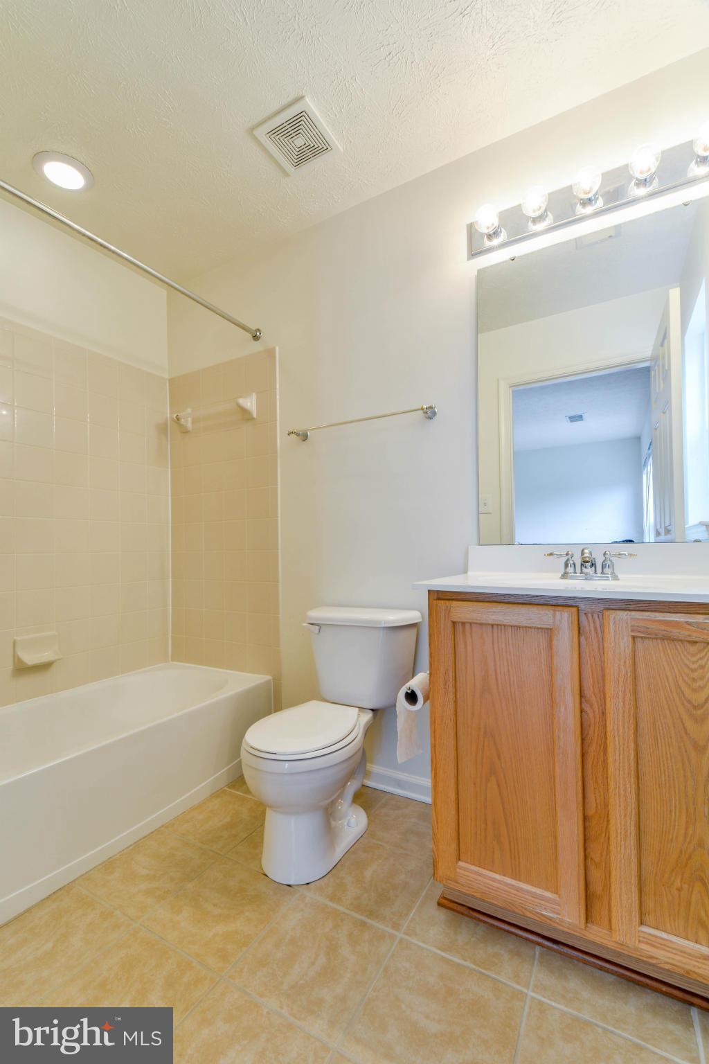 1447 Pangbourne Way Hanover, MD 21076 - Photo 22 of 30 a bathroom with a sink a toilet and shower
