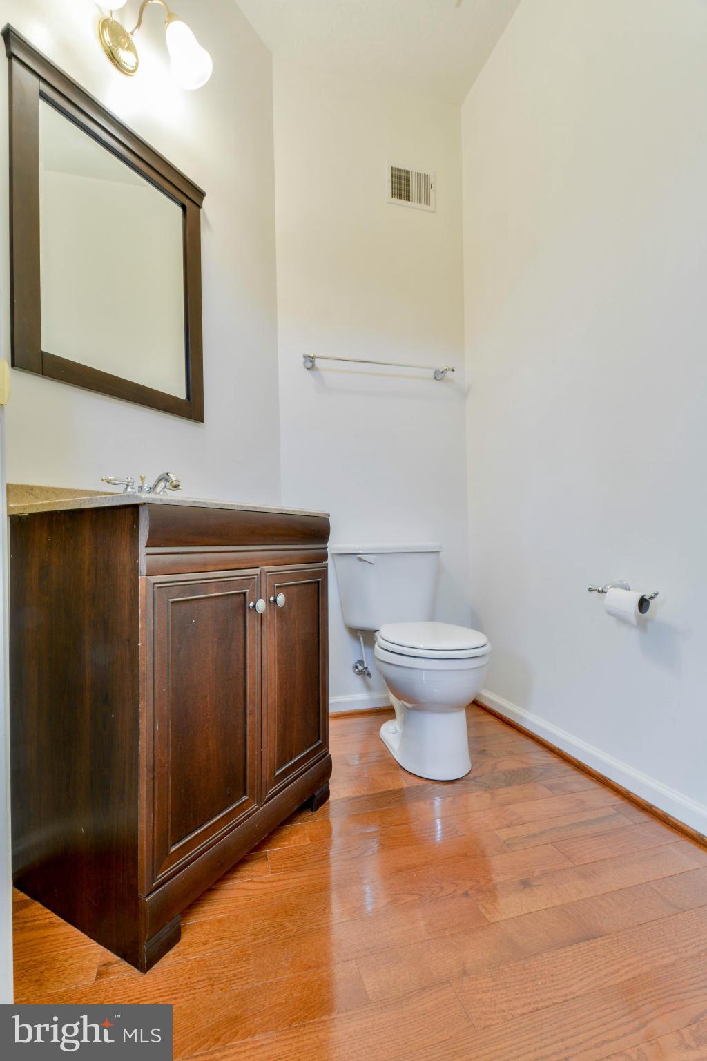 1447 Pangbourne Way Hanover, MD 21076 - Photo 29 of 30 a bathroom with a toilet and a mirror