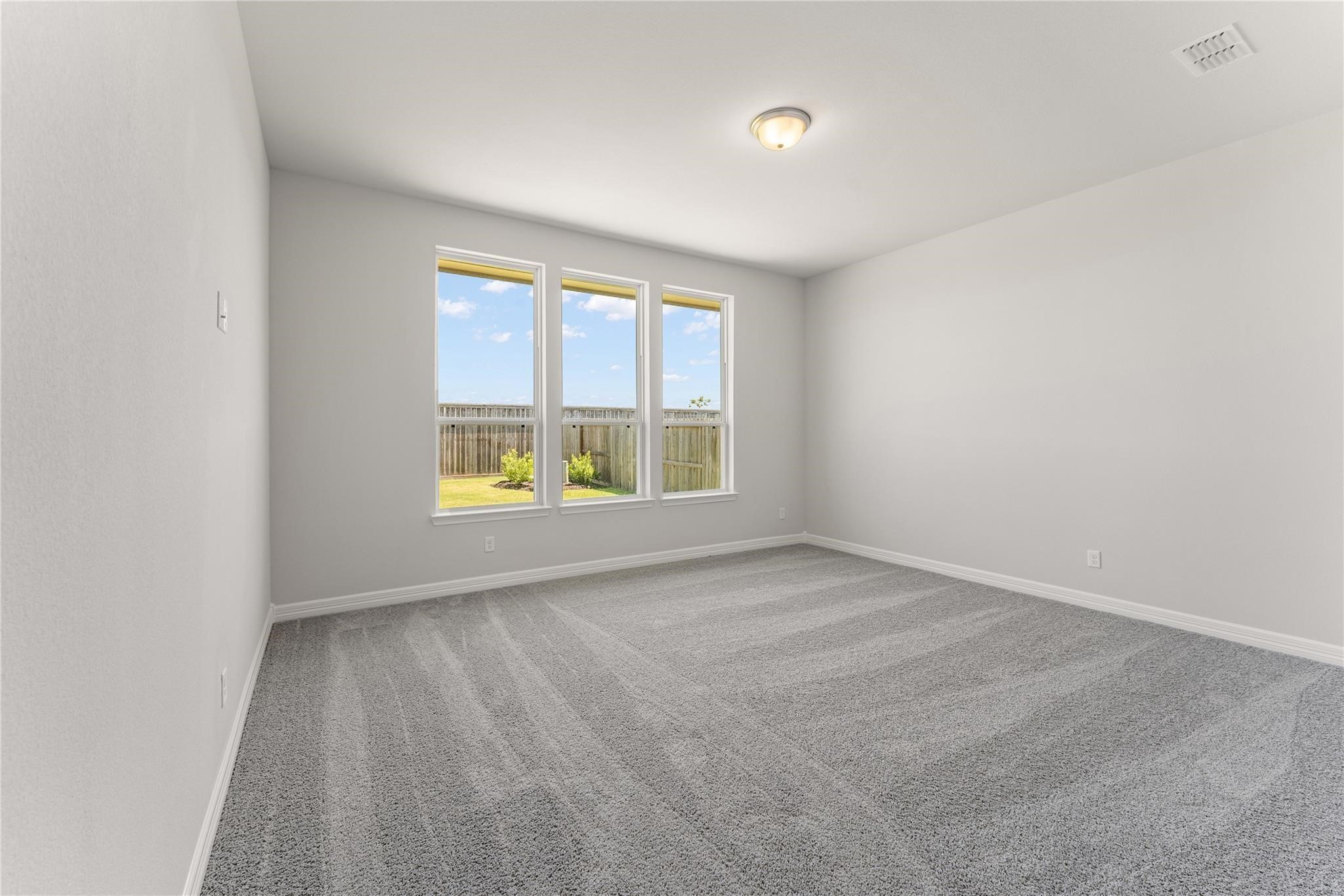 28938 Hauter Way Fulshear, TX 77441 - Photo 21 of 42 an empty room with a window