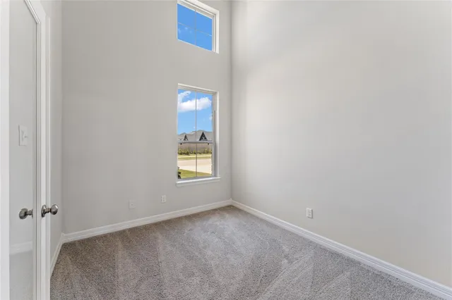 a view of an empty room and a window