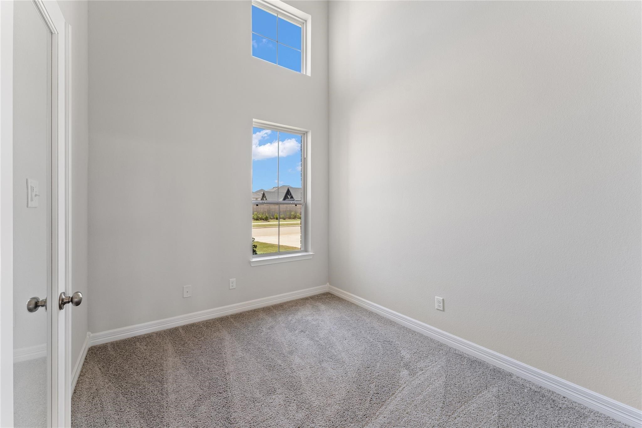 28938 Hauter Way Fulshear, TX 77441 - Photo 24 of 42 a view of an empty room and a window