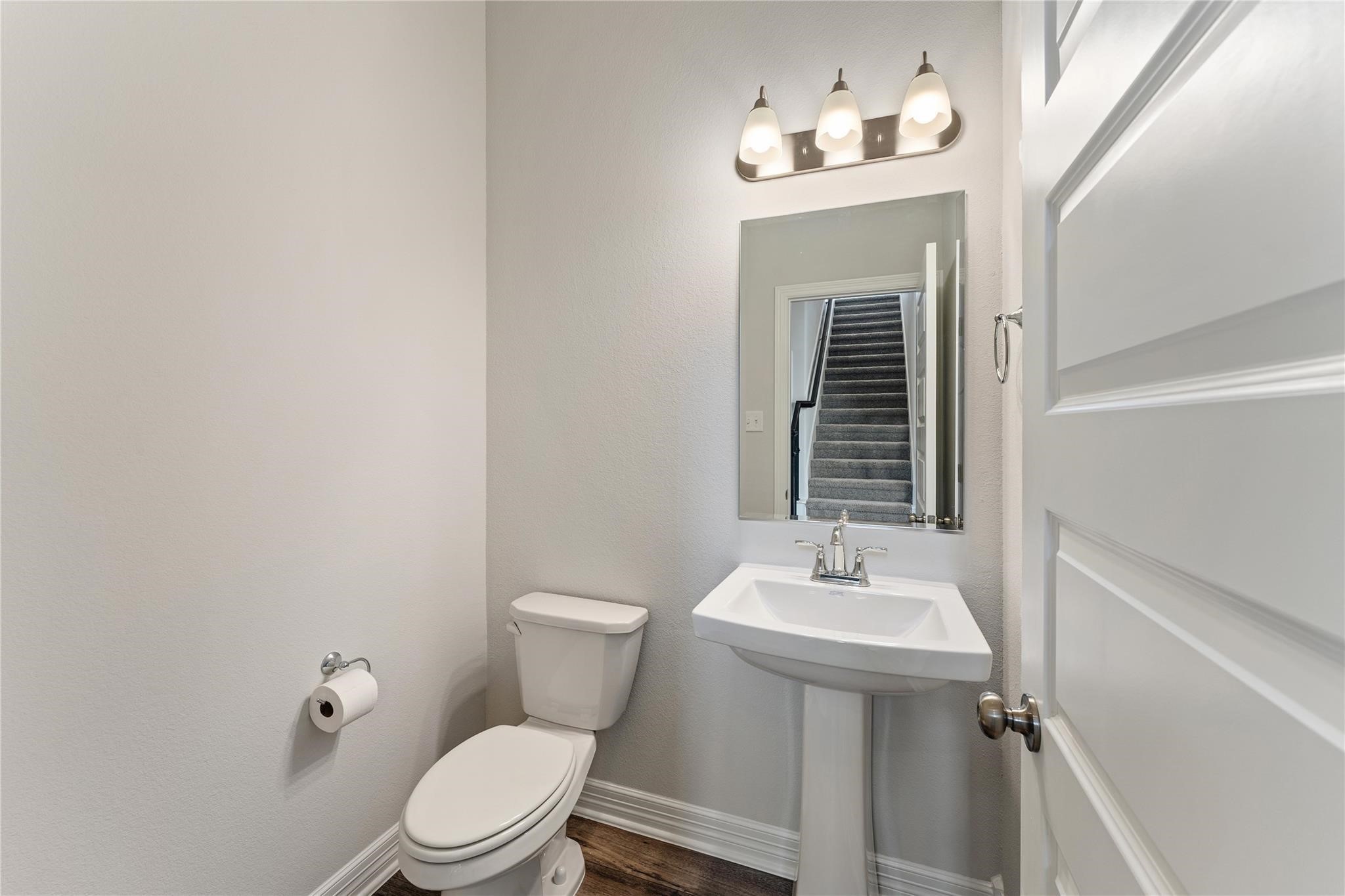 28938 Hauter Way Fulshear, TX 77441 - Photo 25 of 42 a bathroom with a sink a mirror and a toilet