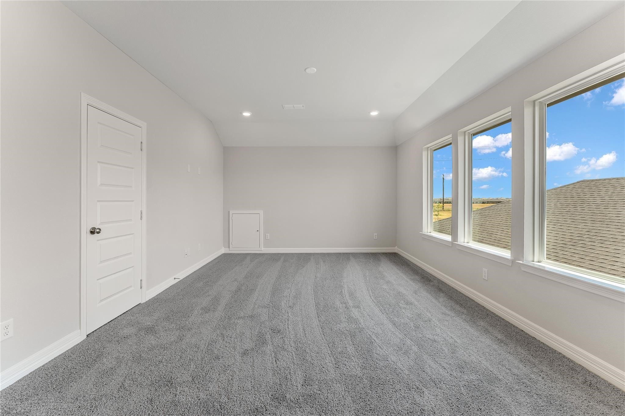 28938 Hauter Way Fulshear, TX 77441 - Photo 31 of 42 wooden floor in an empty room with a window