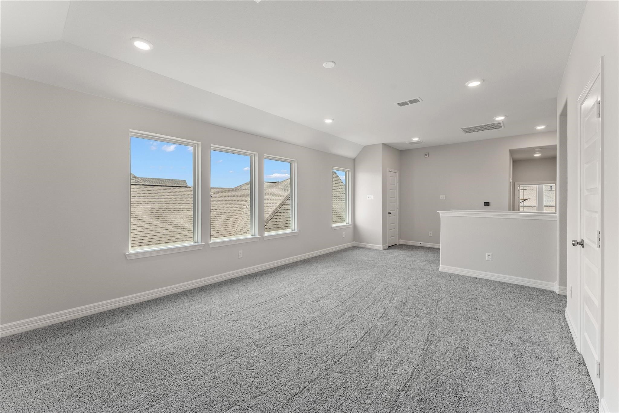 28938 Hauter Way Fulshear, TX 77441 - Photo 32 of 42 a view of an empty room with a window