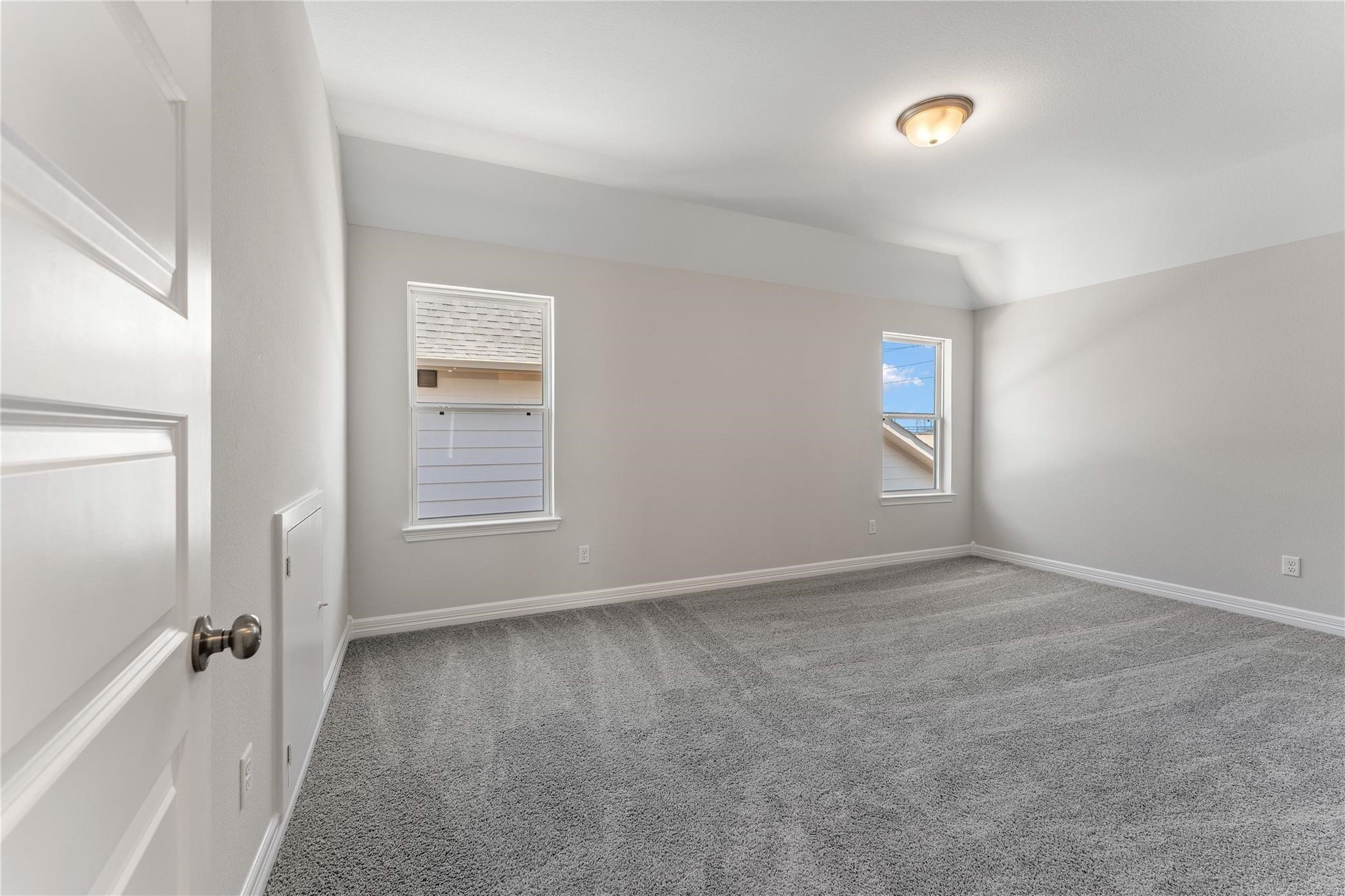 28938 Hauter Way Fulshear, TX 77441 - Photo 34 of 42 a view of an empty room with a window