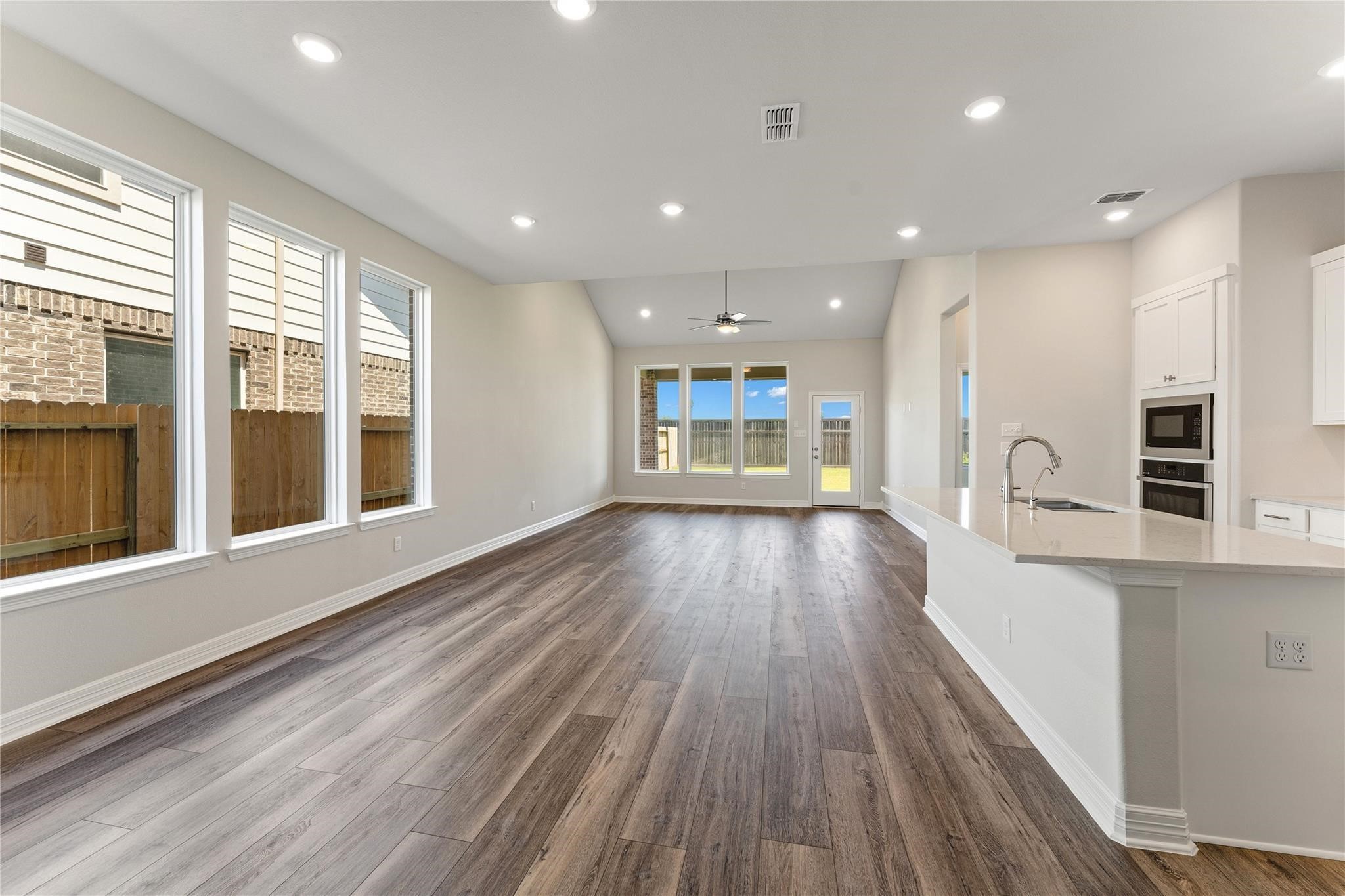 28938 Hauter Way Fulshear, TX 77441 - Photo 6 of 42 a view of kitchen with a sink and wooden floor