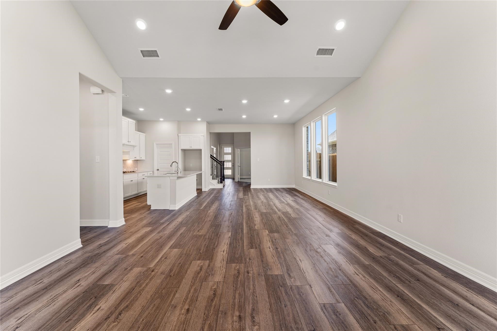 28938 Hauter Way Fulshear, TX 77441 - Photo 9 of 42 a view of kitchen and wooden floor