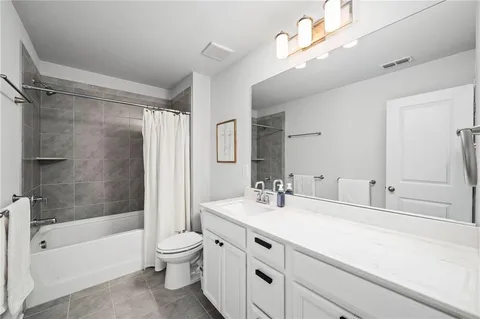 a bathroom with a sink a toilet and a bathtub