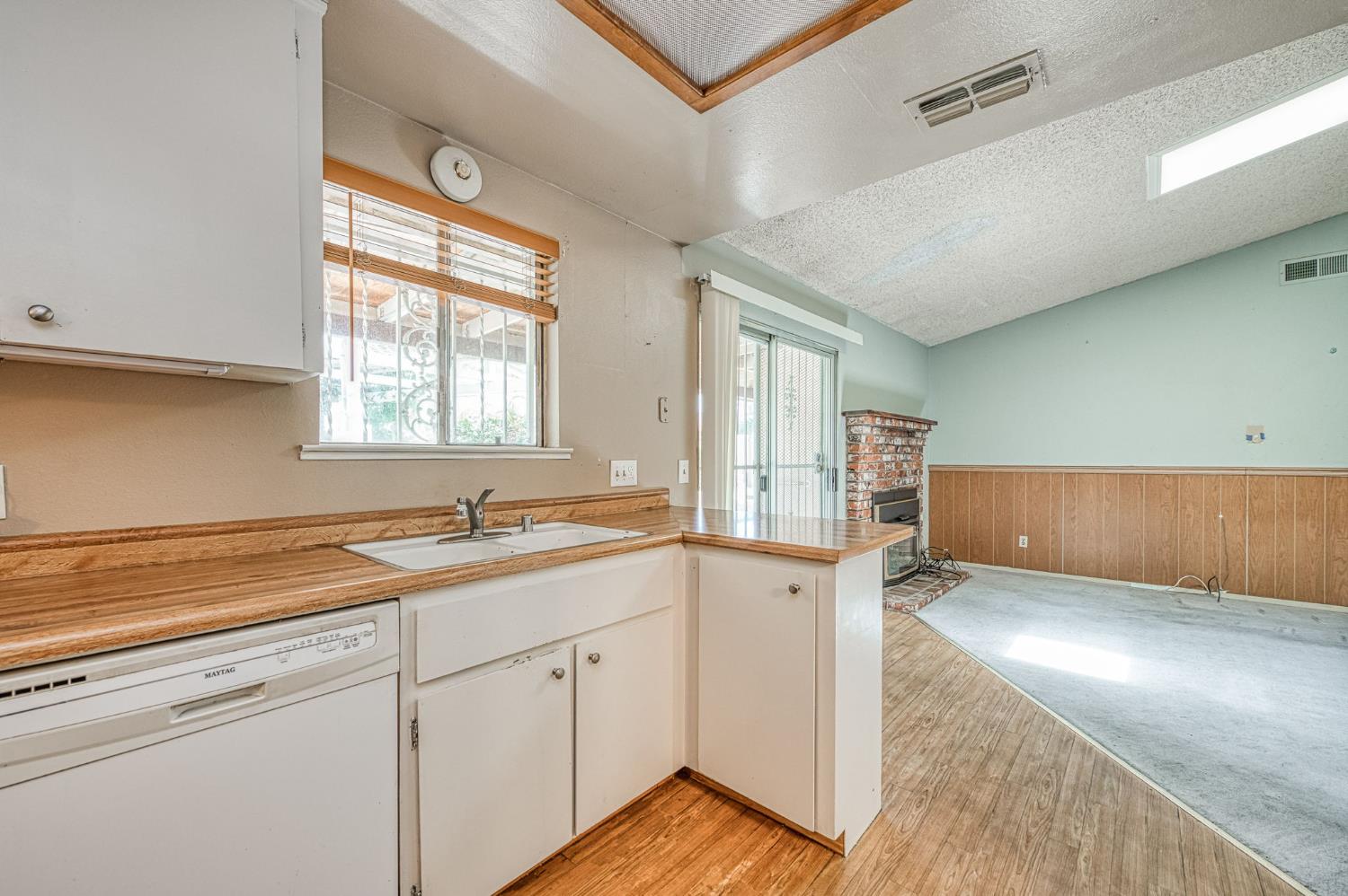491 West Indianapolis Avenue Clovis, CA 93612 - Photo 13 of 32 a kitchen with a sink cabinets and window