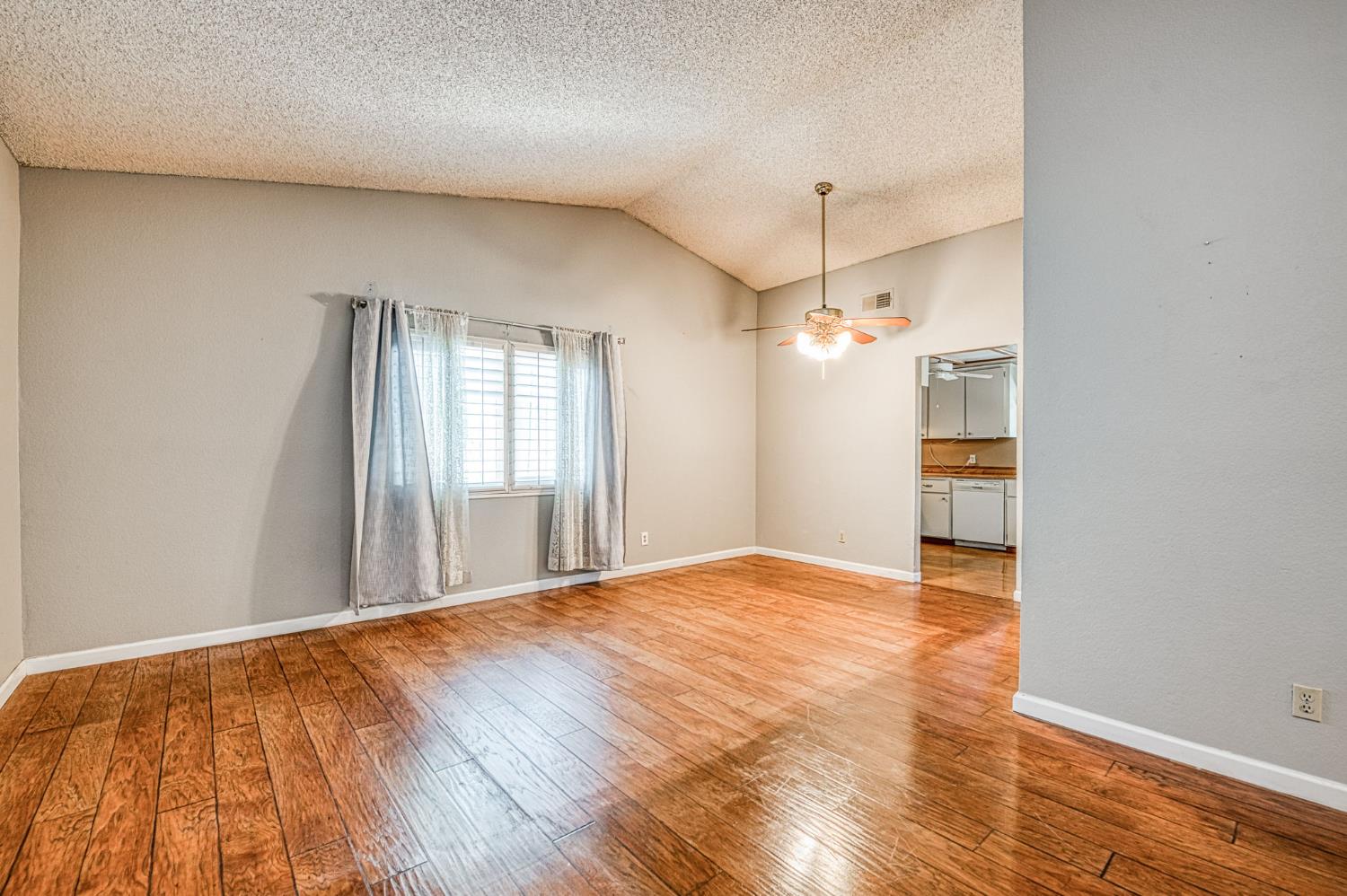 491 West Indianapolis Avenue Clovis, CA 93612 - Photo 3 of 32 a view of a room with wooden floor and window