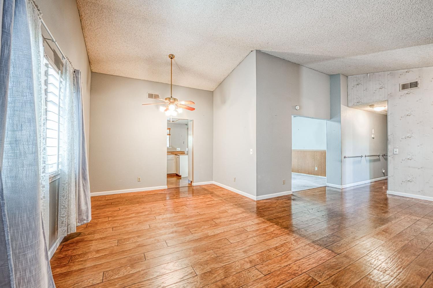 491 West Indianapolis Avenue Clovis, CA 93612 - Photo 4 of 32 a view of a kitchen with a sink and refrigerator