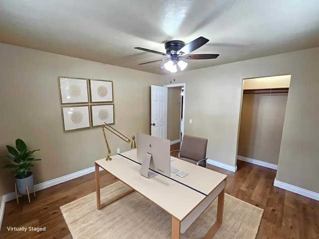 a bathroom with a granite countertop tub sink and mirror