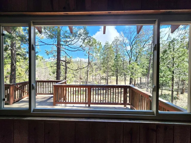 a view of a balcony with wooden floor