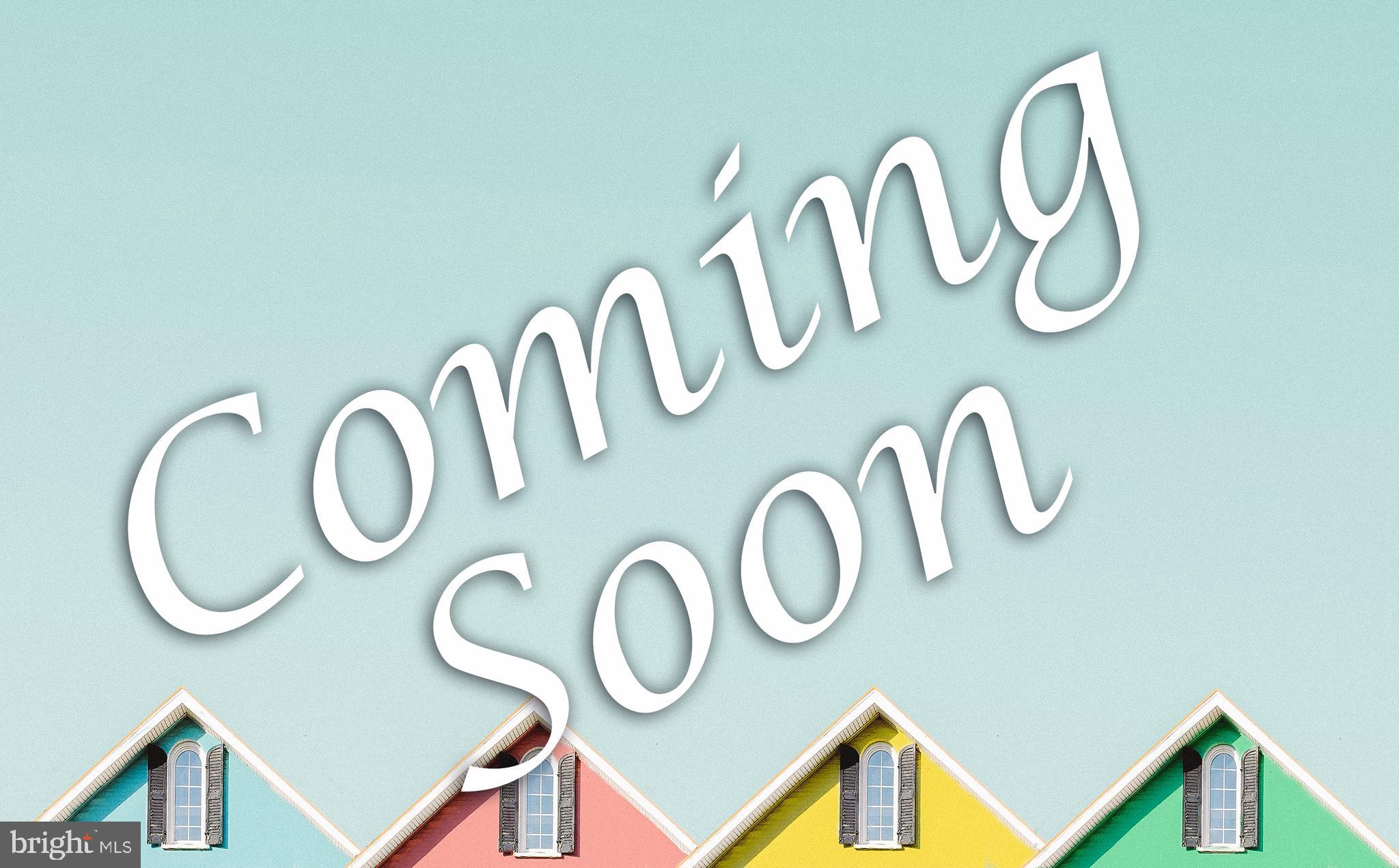 a group of white wall under a sign board