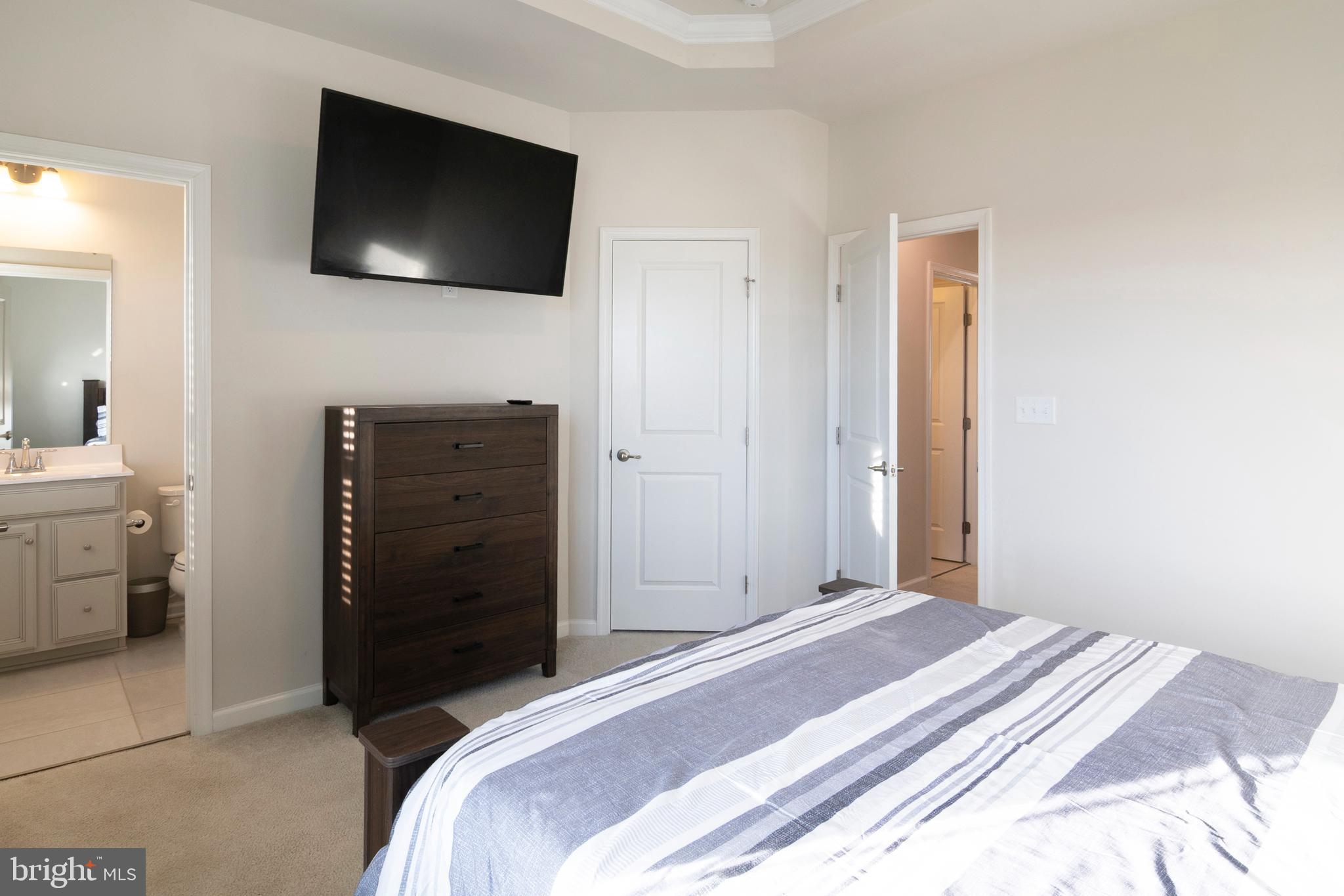 33 Roundstone Run Swedesboro, NJ 08085 - Photo 26 of 43 a bedroom with a bed and a flat screen tv