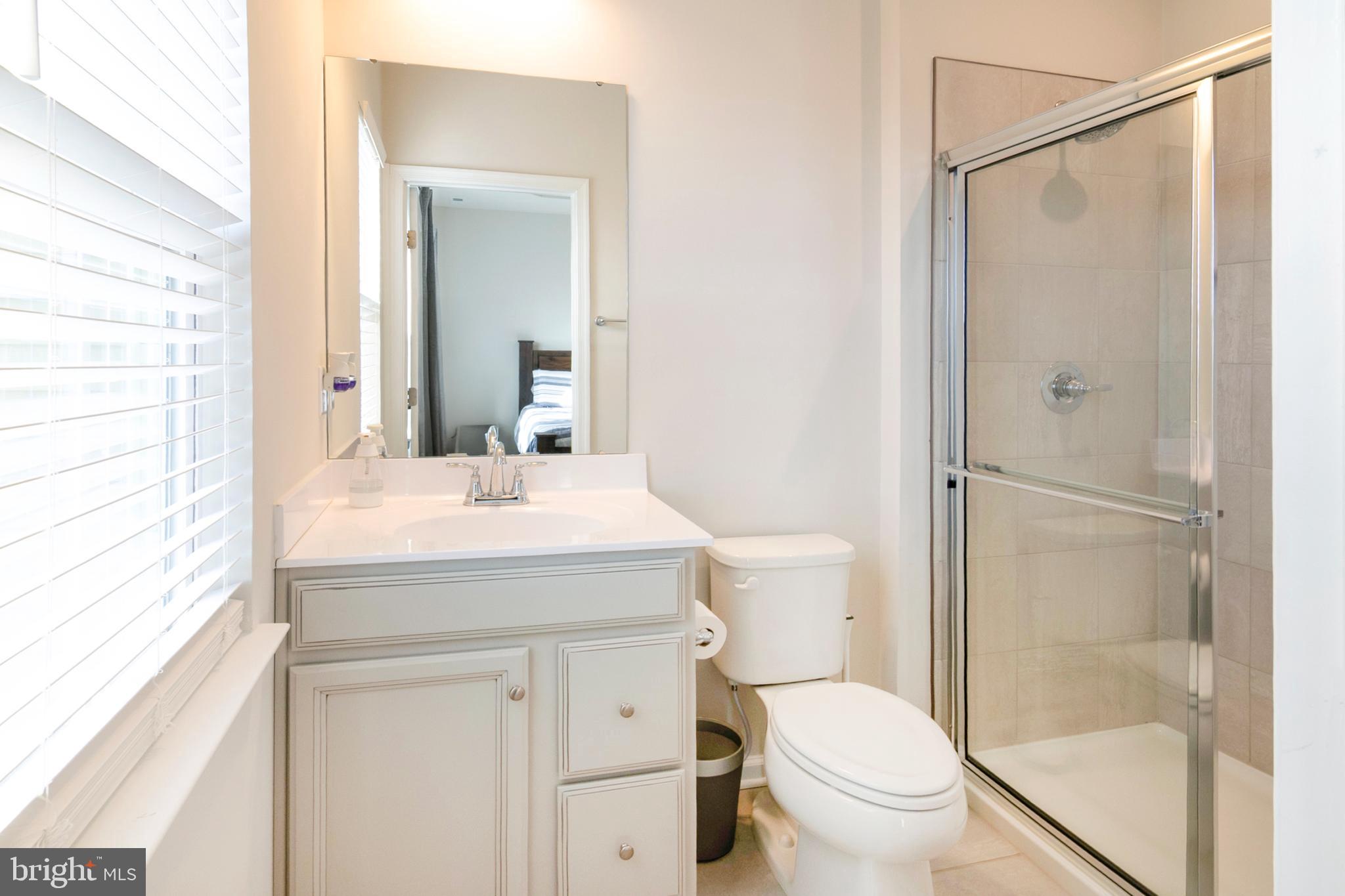 33 Roundstone Run Swedesboro, NJ 08085 - Photo 27 of 43 a bathroom with a granite countertop sink toilet and shower