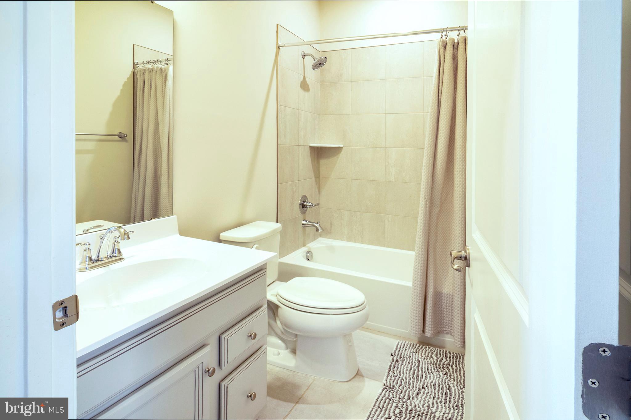 33 Roundstone Run Swedesboro, NJ 08085 - Photo 34 of 43 a bathroom with a sink a toilet and shower