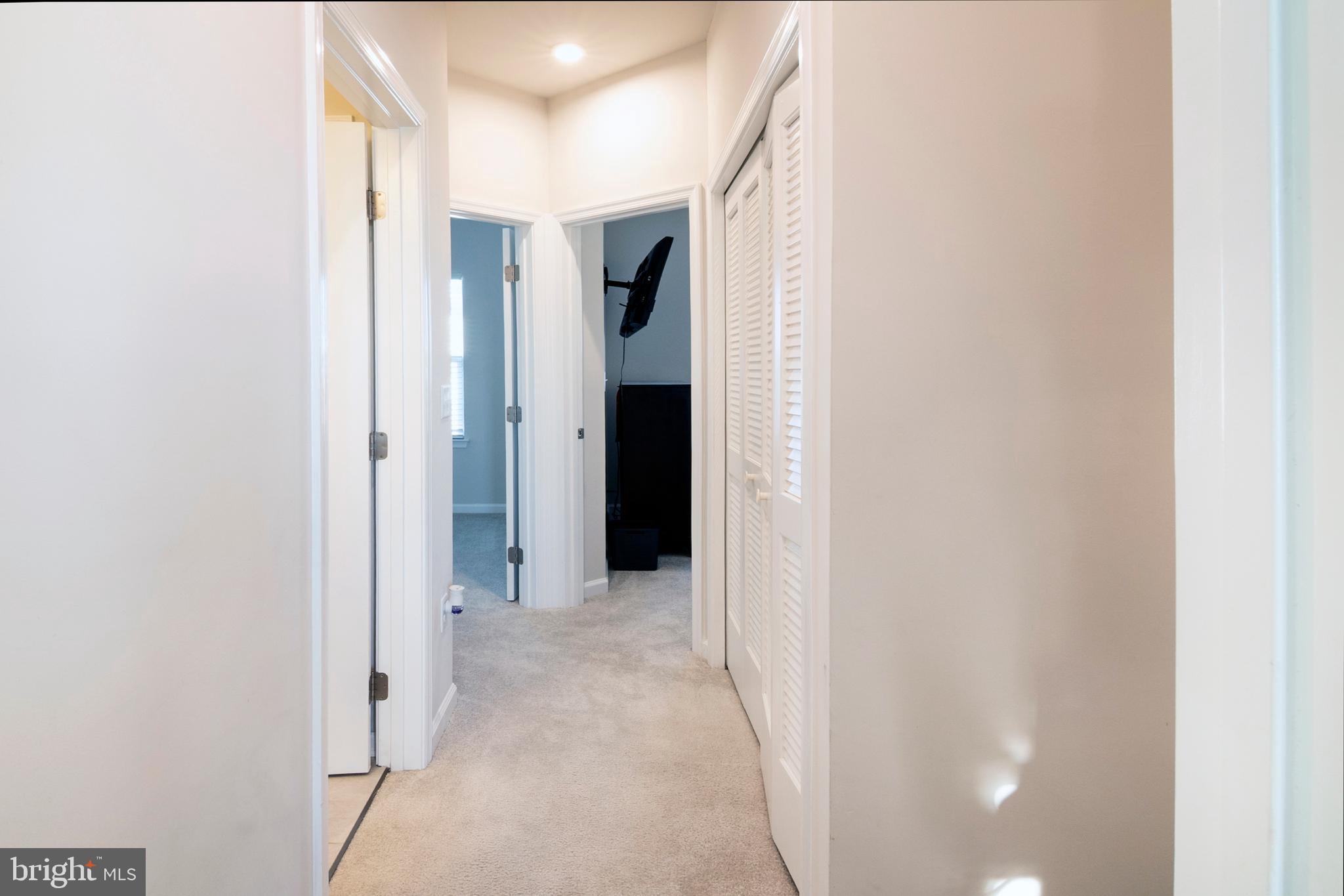 33 Roundstone Run Swedesboro, NJ 08085 - Photo 35 of 43 a view of a hallway with closet and bathroom
