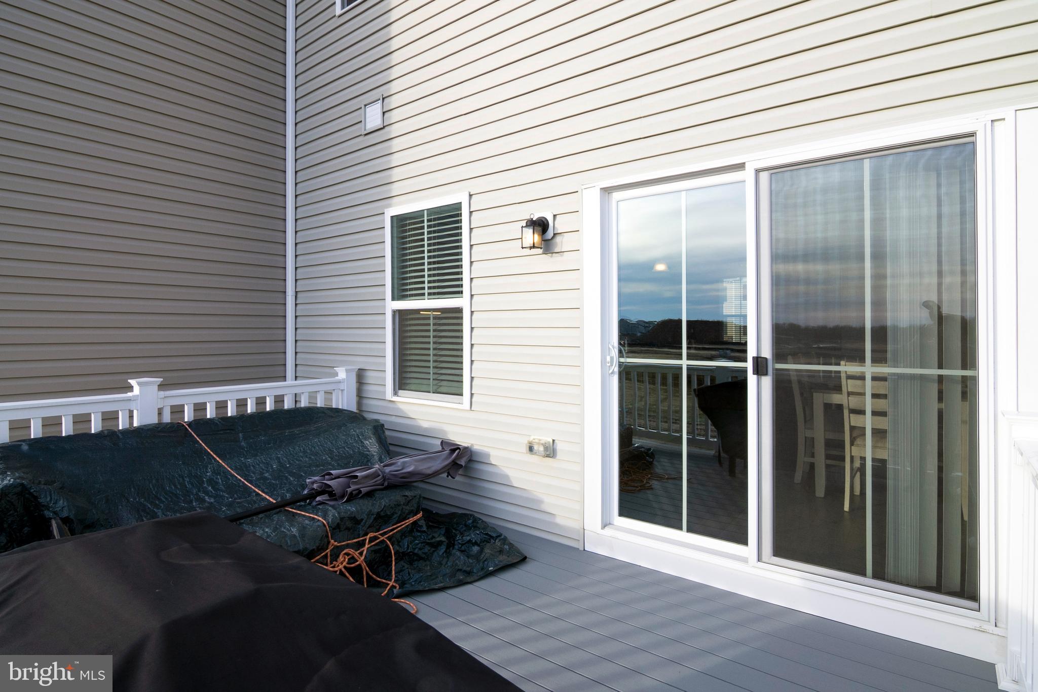 33 Roundstone Run Swedesboro, NJ 08085 - Photo 39 of 43 a backyard of a house with table and chairs
