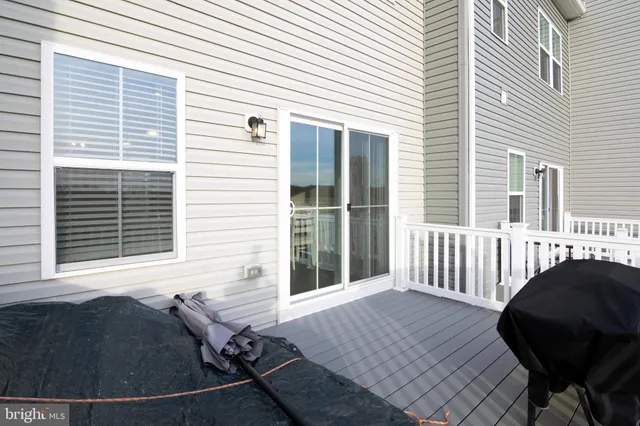 a view of a chair and table in the balcony
