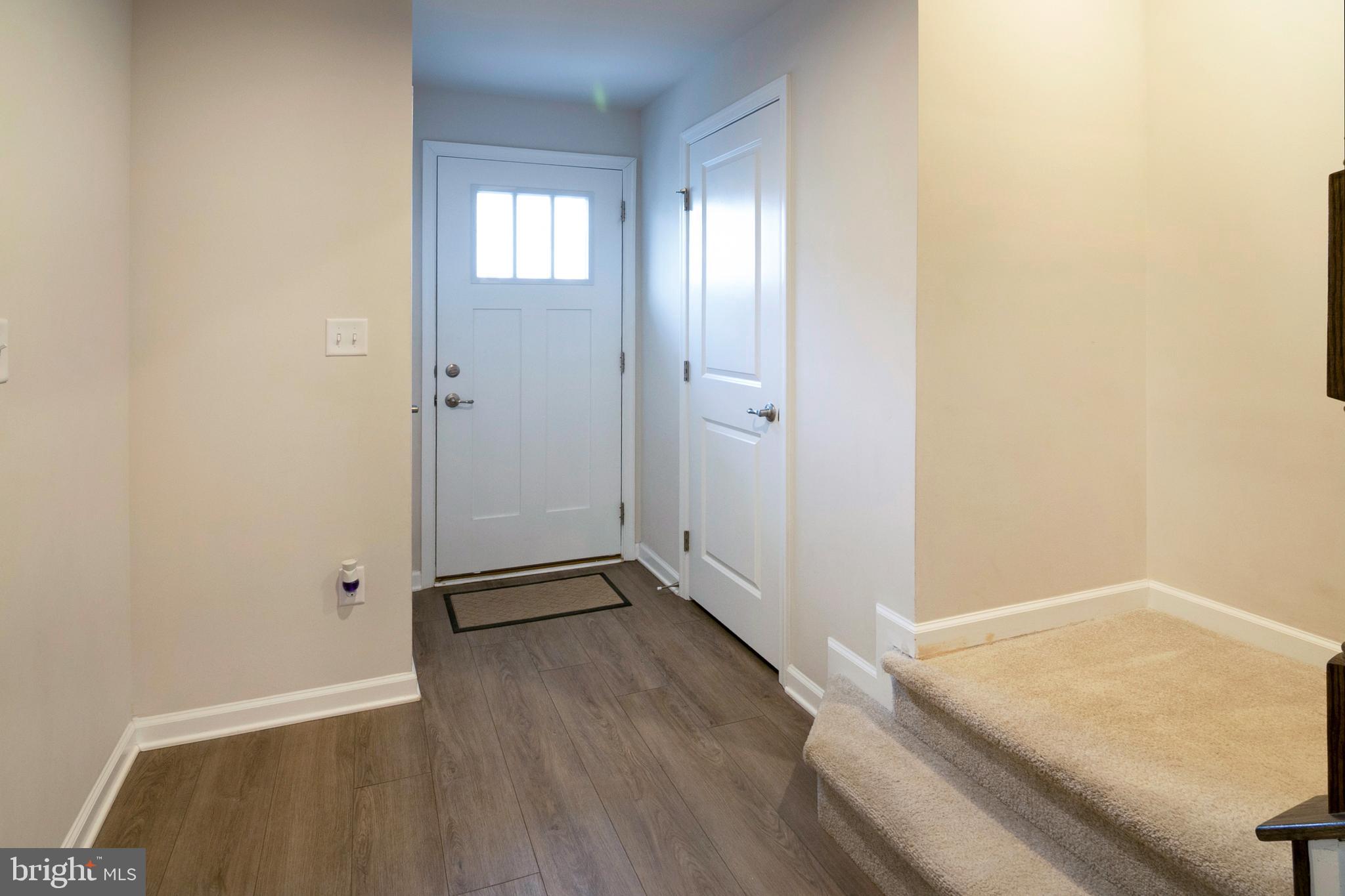 33 Roundstone Run Swedesboro, NJ 08085 - Photo 6 of 43 a view of an empty room with wooden floor