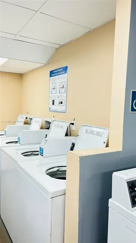 a view of swimming pool with outdoor seating and lake view