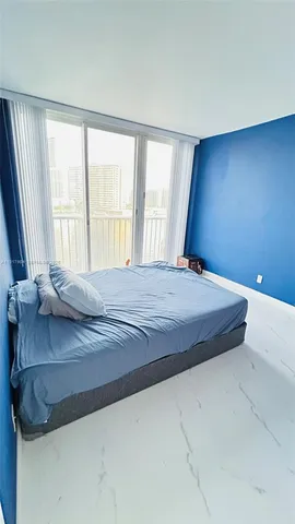 a balcony with table and chairs