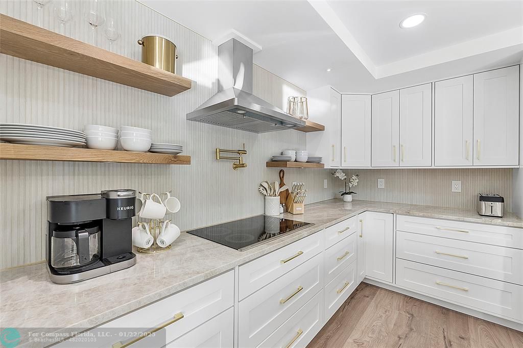 3540 Northeast 28th Avenue Lighthouse Point, FL 33064 - Photo 24 of 53 Electric stove top with hood