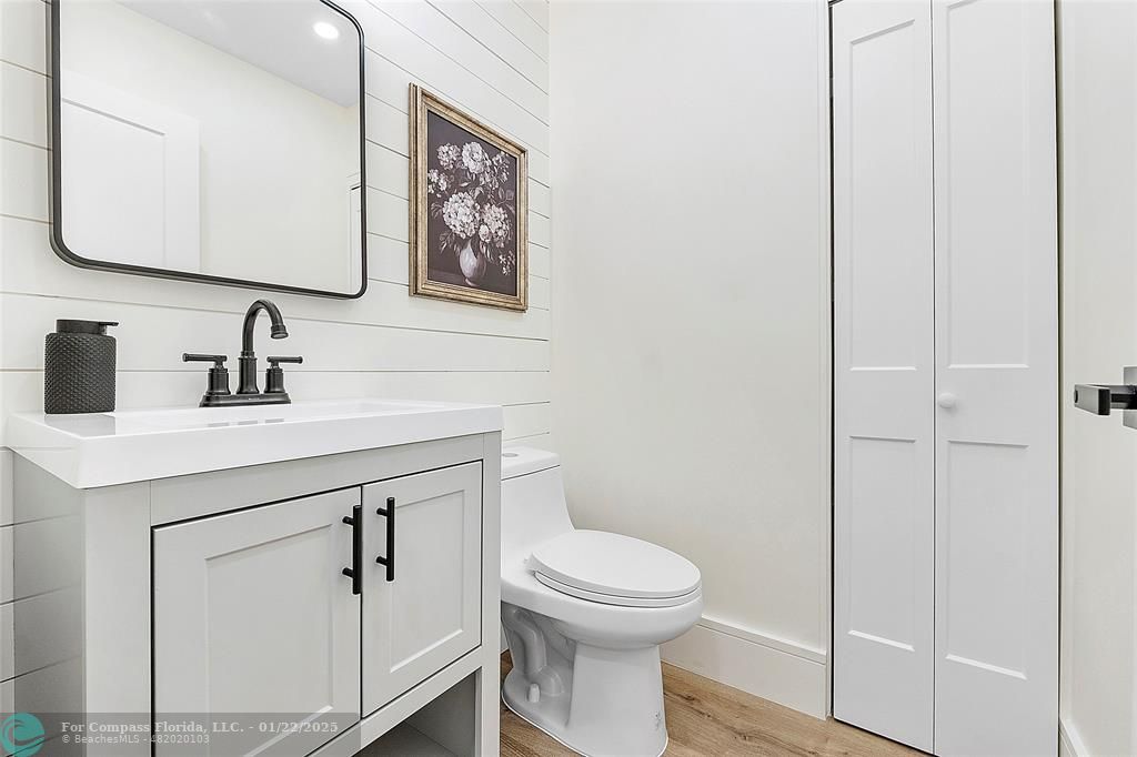 3540 Northeast 28th Avenue Lighthouse Point, FL 33064 - Photo 42 of 53 Half bathroom with linen closet