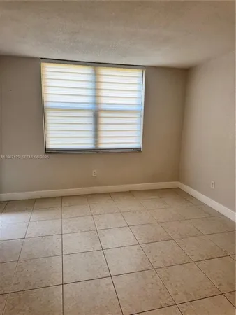 a view of a room that has a window in it