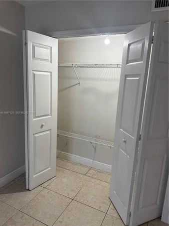 a bathroom with a double vanity sink a mirror and a shower