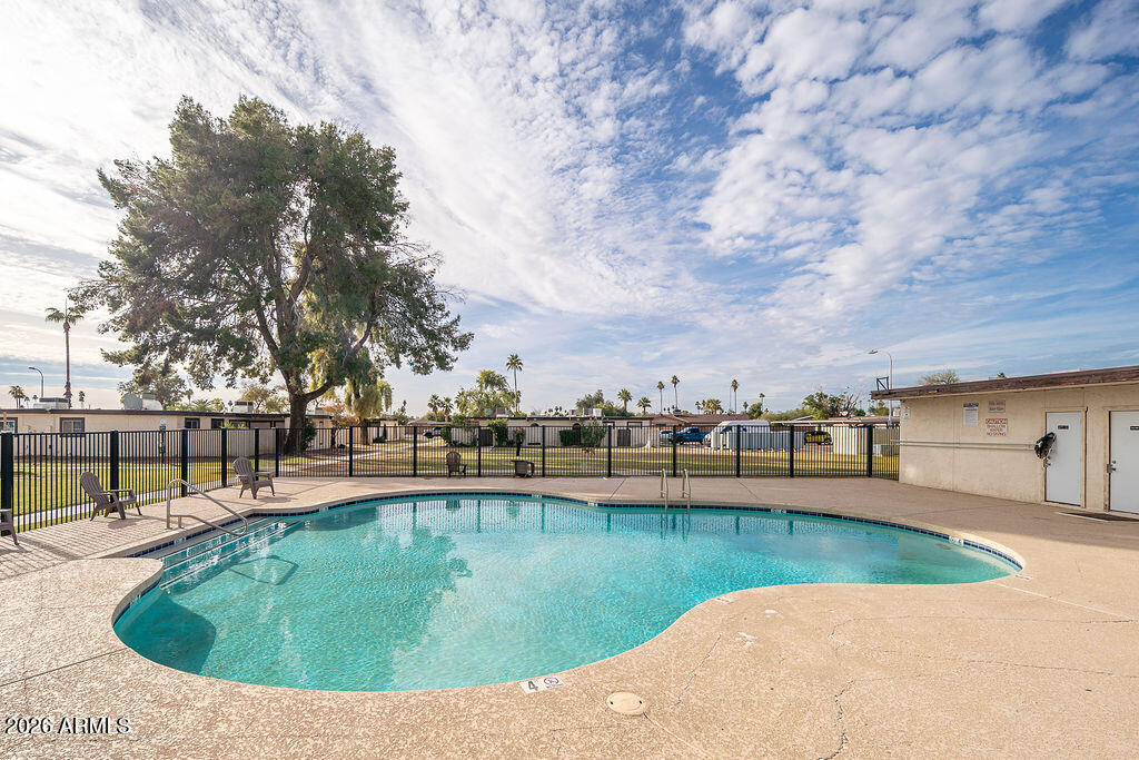 720 South Dobson Road, Unit 85 Mesa, AZ 85202 - Photo 19 of 25 a view of a swimming pool with an outdoor seating