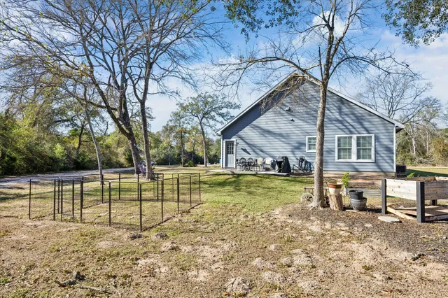 a view of a house with a big yard