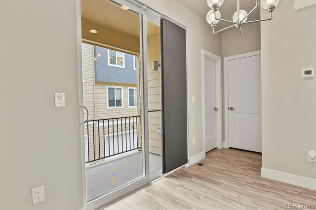 a view of an entryway with wooden floor