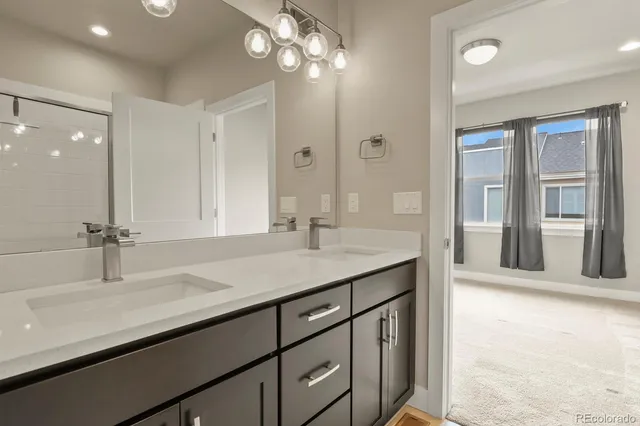 a bathroom with a sink double vanity and a mirror