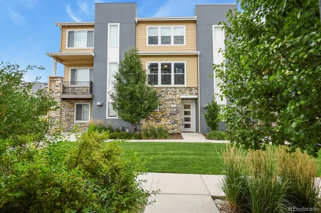 a view of a house with a yard and plants